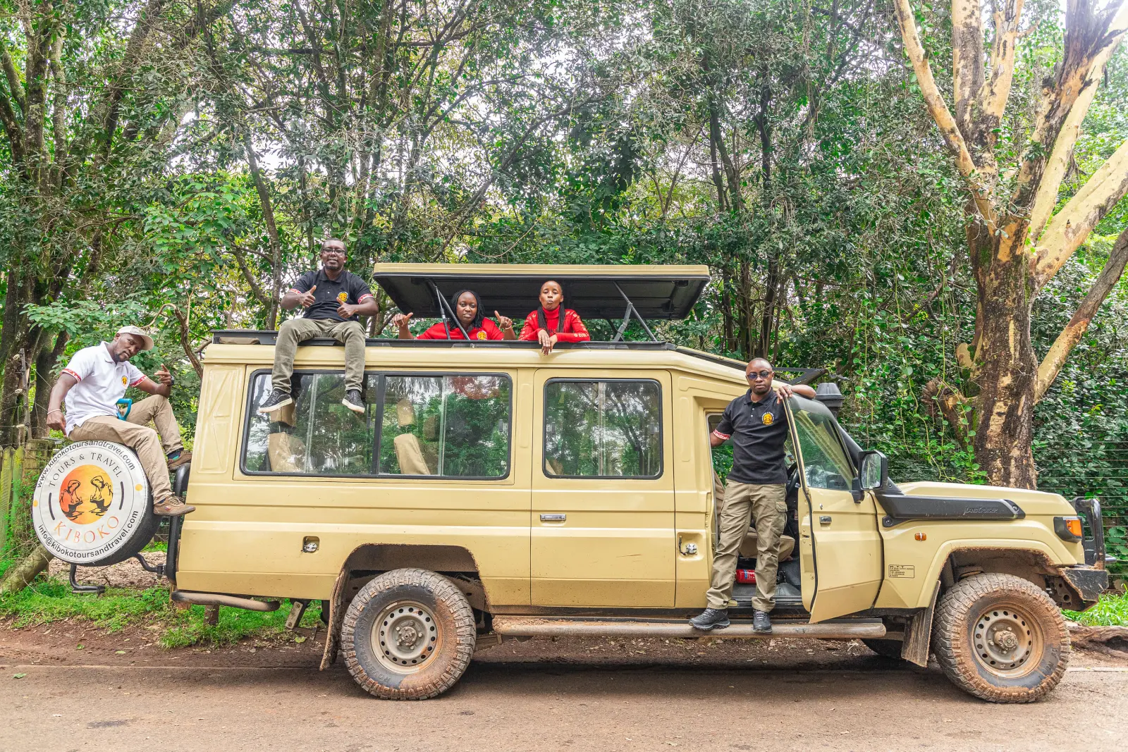 A Kiboko Tours and Travel Land Cruiser with guests on board